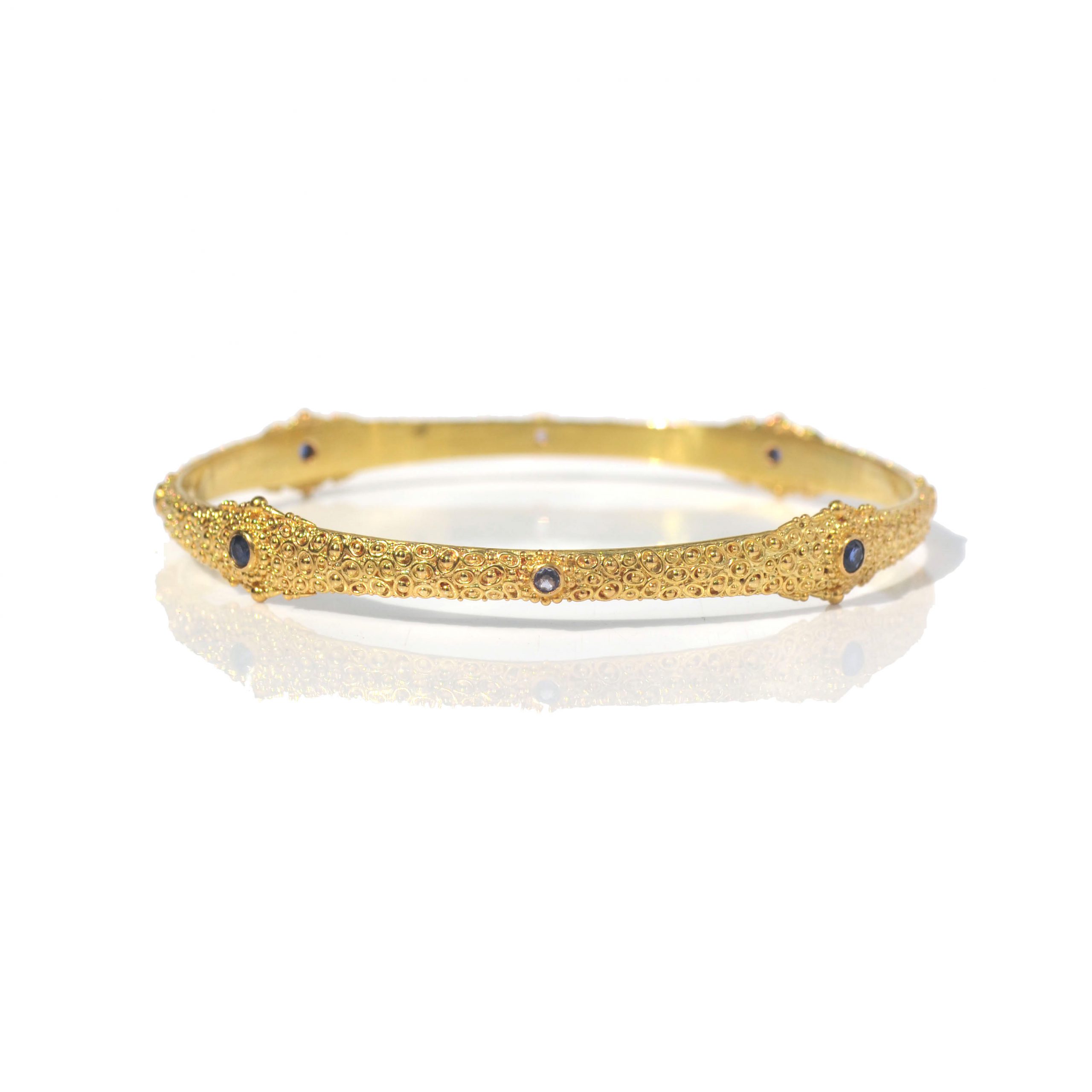 Mystic bangle with Blue sapphires set in 22 ct gold- D271